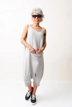 Grey Oversized Sleeveless Jumpsuit Paired with a Top with Long Sleeves